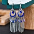 Brilho e Sofisticação em Cada Detalhe! ✨Brincos Elegantes Boho-Chic – Multi camadas de cristal e strass, com design em formato de gota e franjas em corrente. Uma joia delicada em liga metálica para mulheres que amam