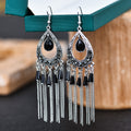 Brilho e Sofisticação em Cada Detalhe! ✨Brincos Elegantes Boho-Chic – Multi camadas de cristal e strass, com design em formato de gota e franjas em corrente. Uma joia delicada em liga metálica para mulheres que amam